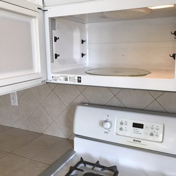 Plus Property Management - They're charging $130 for having to clean out the microwave and the stove this picture proves they were clean - Property Management Near Me - Santa Maria, California