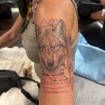 Firma Tattoo - Wolf tattoo with Quebecois and Inuktitut writing in dedication to missing sister. - Tattoo Near Me - La Mesa, California Firma Tattoo - Wolf tattoo with Quebecois and Inuktitut writing in dedication to missing sister. - Tattoo Near Me - La Mesa, California