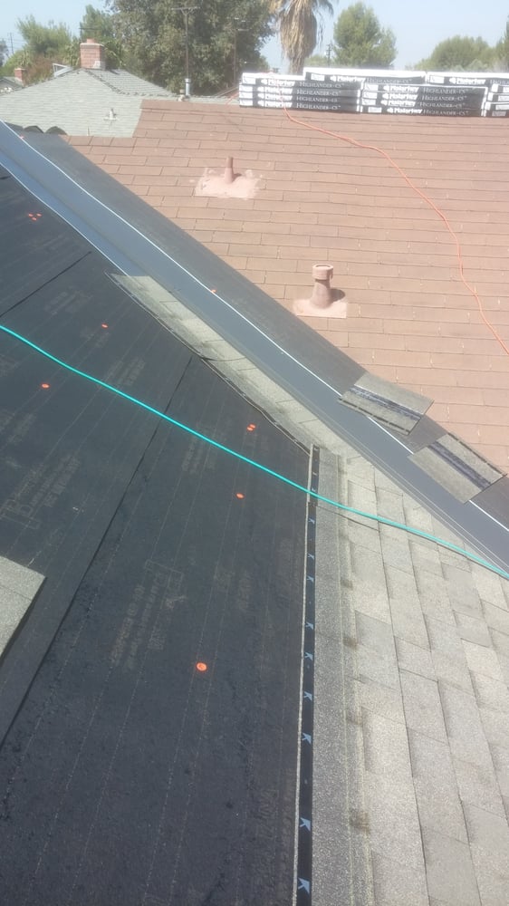 Slide of Revo Roof Company