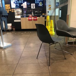 two chairs and a table in a restaurant two chairs and a table in a restaurant