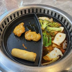 Shabu Hotpot - Split plate for soup and warming dish for appetizers that come from conveyor belt.