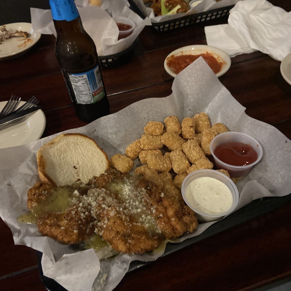 Main Street Tavern - Fried chicken sandwich with garlic Parmesan sauce and tots. - American Near Me - Montevallo, Alabama Main Street Tavern - Fried chicken sandwich with garlic Parmesan sauce and tots. - American Near Me - Montevallo, Alabama