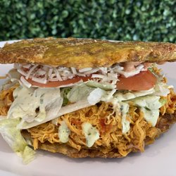 Arepa Burger - Waterford Lakes - Fried plantain with shredded chicken / patacón con pollo desmechado