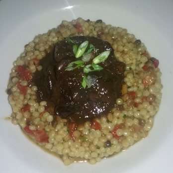AQUA e VINO - Lamb in prune sauce with whole almonds over pearl pasta - Italian Near Me - Charlotte, North Carolina