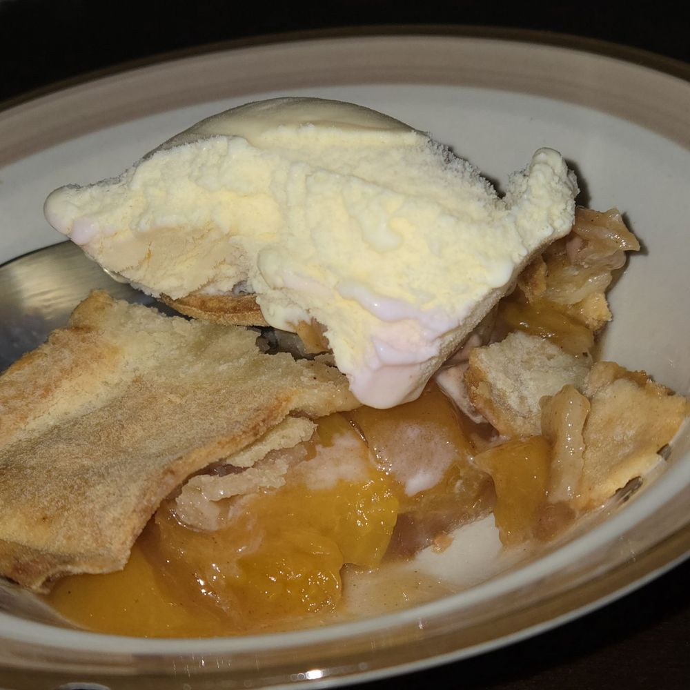 Clifton's Gourmet Barbecue - We brought the peach cobbler home. Half of the peach cobbler with a scope of vanilla. - Southern Near Me - Pasadena, California