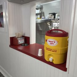 Whit's Frozen Custard - Pick up window with complimentary water