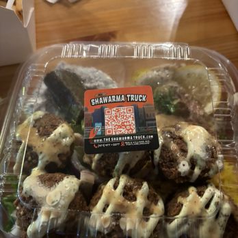 Shawarma House - a tray of meatballs covered in gravy sauce - Mediterranean Near Me - Portland, Oregon Shawarma House - a tray of meatballs covered in gravy sauce - Mediterranean Near Me - Portland, Oregon