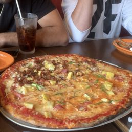 a large pizza with pineapple toppings a large pizza with pineapple toppings