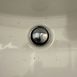 Black residue in bathroom sink.
