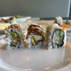 Kyoto Sushi & Grill- Winter Park - The three sushi rolls I ordered - L to R - shrimp tempura roll with cream cheese, eel roll, rainbow roll (tune sliver on top removed).