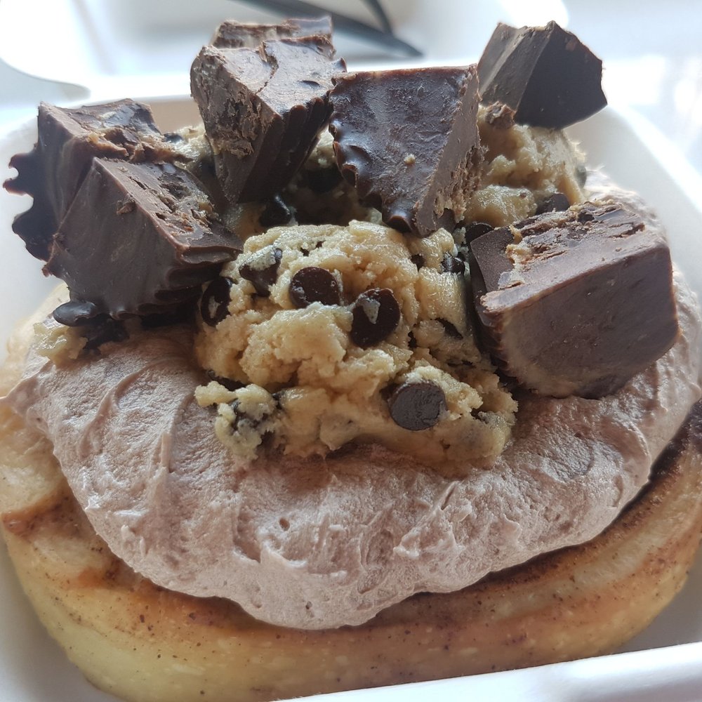 Cinnaholic - Customized roll: chocolate frosting with peanut butter cups and cookie dough toppings - Bakeries Near Me - Toronto, Ontario Cinnaholic - Customized roll: chocolate frosting with peanut butter cups and cookie dough toppings - Bakeries Near Me - Toronto, Ontario