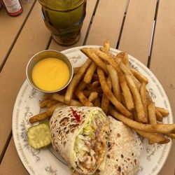 Minnow’s - Chipotle chicken wrap with cajun cheese fries. Mango Peach Matcha Tea