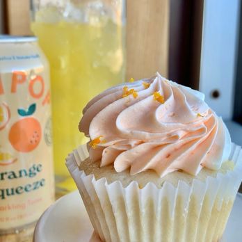 Allie Grace Bakery - a cupcake with frosting and a can of orange juice - Cupcakes Near Me - Lawrenceburg, Tennessee Allie Grace Bakery - a cupcake with frosting and a can of orange juice - Cupcakes Near Me - Lawrenceburg, Tennessee