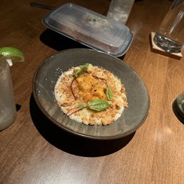 Coconut Rice Pudding; grilled mango, pineapple reduction,coconut crumb; $13 Coconut Rice Pudding; grilled mango, pineapple reduction,coconut crumb; $13