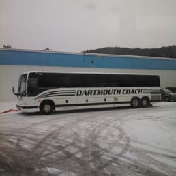 Bus idling in the snowy lot.