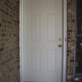 Master Tile Workz - a white front door - Flooring Near Me