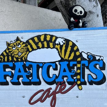 Fat Cats Cafe - Travel companion, Marci, showing her love for Fat Cats. - Seafood Near Me - Avila Beach, California Fat Cats Cafe - Travel companion, Marci, showing her love for Fat Cats. - Seafood Near Me - Avila Beach, California
