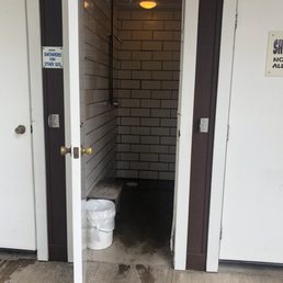 Unisex showers placed around the outside of the bathrooms. PLENTY of shower stalls.