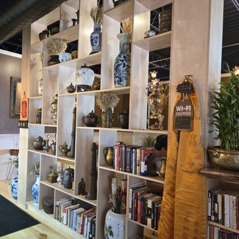 Momo Cafe - The decorated wall that divides the 2 rooms - Coffee & Tea Near Me - Minneapolis, Minnesota