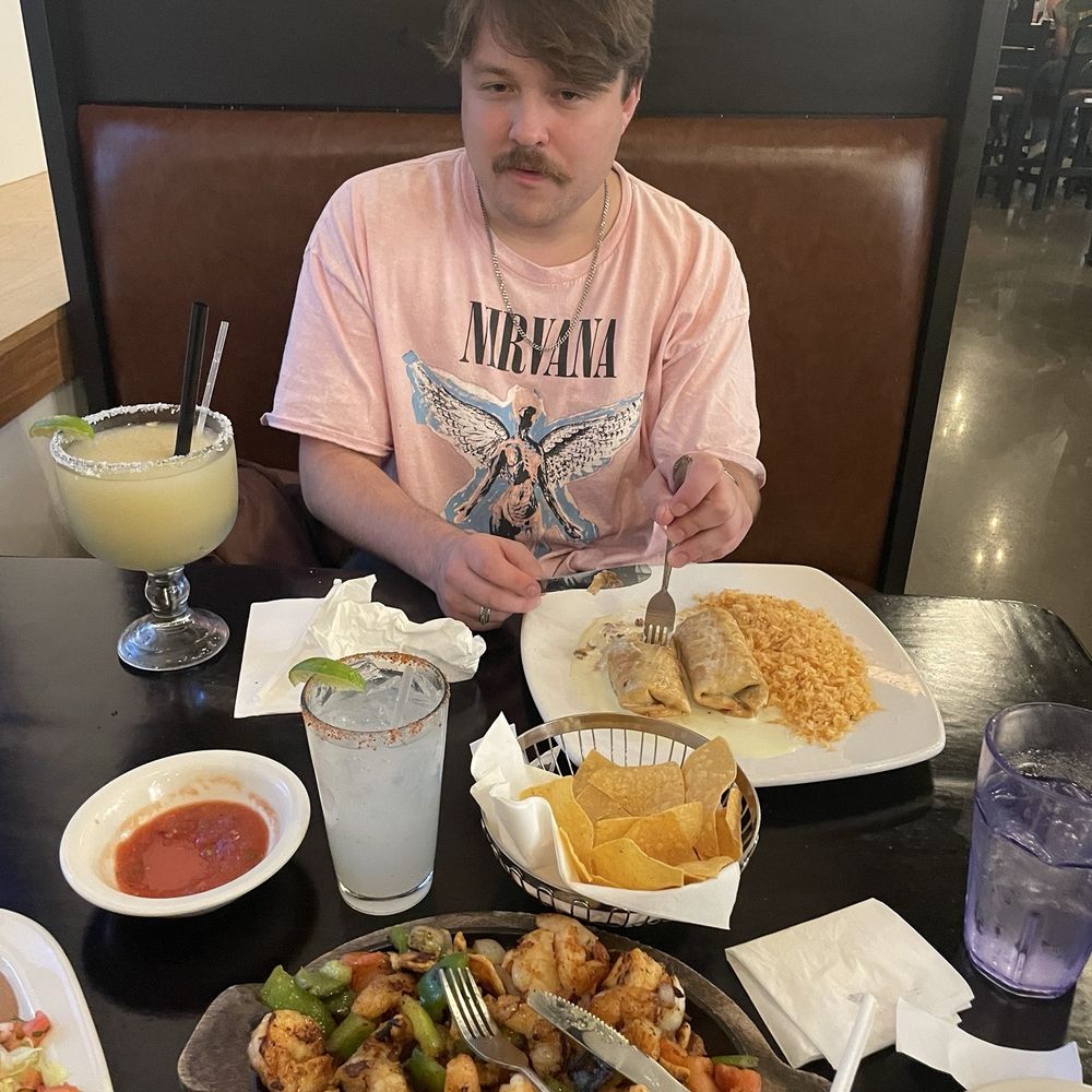 My partner and I enjoying the food (Shrimp Fajitas) My partner and I enjoying the food (Shrimp Fajitas)
