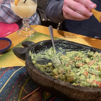 Cinco De Mayo - a person eating guacamole - Mexican Near Me - Holland, Ohio
