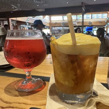 Monkeypod Kitchen - Monkeypod Mai Tai and dragonfruit seltzer - New American Near Me - Lahaina, Hawaii