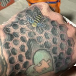 Topnotch Tattoo - Their awful work of a honeycomb