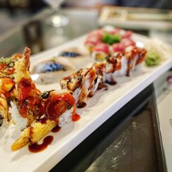 Mootone Fine Japanese Cuisine - Alligator Maki - shrimp tempura, topped with eel, crabmeat, sweet chili sauce, eel sauce.