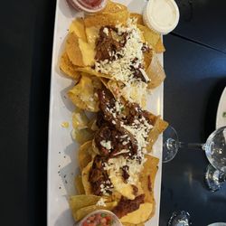 Kim's - The 1/2 size of Pulled Pork Nachos.  Not enough melted cheese, but a huge serving.