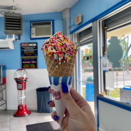 Vanilla waffle cone with rainbow sprinkles