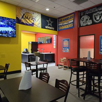 Extreme Wild Wings - Inside with sports team banners - Chicken Wings Near Me - Arroyo Grande, California Extreme Wild Wings - Inside with sports team banners - Chicken Wings Near Me - Arroyo Grande, California