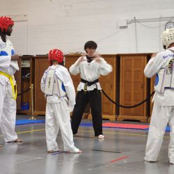 Blue Knight Taekwondo - In the Middle, our National champ in sparring, teaching a sparring class