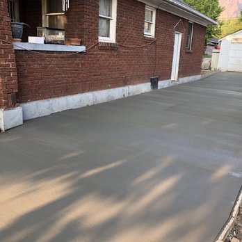 FRA Landscape and Concrete - a brick house with a garage - Masonry/Concrete Near Me FRA Landscape and Concrete - a brick house with a garage - Masonry/Concrete Near Me