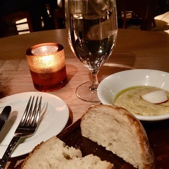 Estia - Complimentary rustic bread with chilled hummus / olive oil / radish. - Greek Near Me - Philadelphia, Pennsylvania