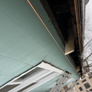 Nicholas Roofing & Tuckpointing - Hanging new gutters/repairing wood - Roofing Near Me Nicholas Roofing & Tuckpointing - Hanging new gutters/repairing wood - Roofing Near Me