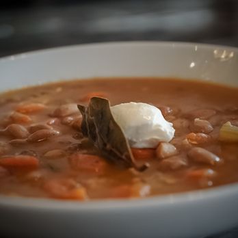 Hungarian Bistro - a bowl of soup with a spoon sticking out of it - Hungarian Near Me - Fairfield, Connecticut Hungarian Bistro - a bowl of soup with a spoon sticking out of it - Hungarian Near Me - Fairfield, Connecticut