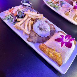 El Boulevard Latin Cuisine & Bar - "Bistec a lo pobre": Steak, White Rice, Fried Sweet Banana (Maduros), French Fries, & Green Salad with Green Mild Sauce.
