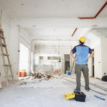 Adouku Design Development Works - a man standing in a construction site - General Contractors Near Me - Catonsville, Maryland Adouku Design Development Works - a man standing in a construction site - General Contractors Near Me - Catonsville, Maryland