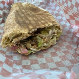 Chicken shawarma with added extras of hummus and tabouli (delivery) Chicken shawarma with added extras of hummus and tabouli (delivery)