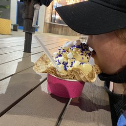 Waffle bowl with vanilla ice cream, sprinkles, and marshmallows. Waffle bowl with vanilla ice cream, sprinkles, and marshmallows.