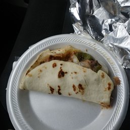a burrito on a paper plate a burrito on a paper plate