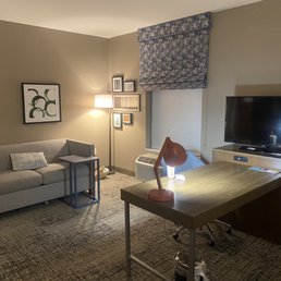 Nice work area and sofa, with table tray to eat and watch the Dish Network with serveral HBO Channels .