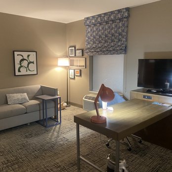 Hampton Inn & Suites St. George SunRiver - Nice work area and sofa, with table tray to eat and watch the Dish Network with serveral HBO Channels . - Hotels Near Me - St George, Utah