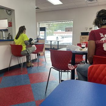 Pita King - a woman sitting at a table in a fast food restaurant - Mediterranean Near Me - Ann Arbor, Michigan Pita King - a woman sitting at a table in a fast food restaurant - Mediterranean Near Me - Ann Arbor, Michigan