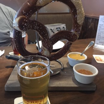 Three Creeks Brew Pub - Knotty Blonde and the pretzel with beer cheese and mustard. - Breweries Near Me - Sisters, Oregon Three Creeks Brew Pub - Knotty Blonde and the pretzel with beer cheese and mustard. - Breweries Near Me - Sisters, Oregon