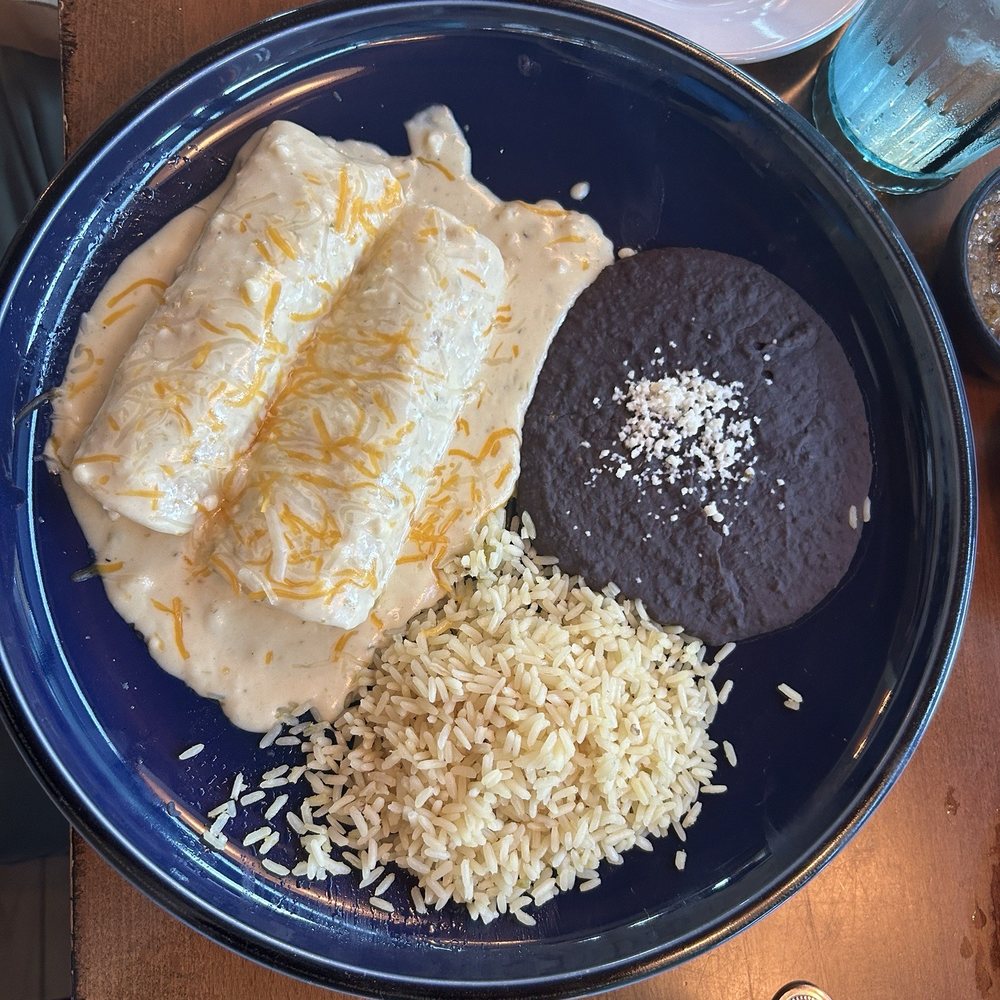 Petra - Cream cheese sauce chicken enchiladas - Mexican Near Me - McKinney, Texas