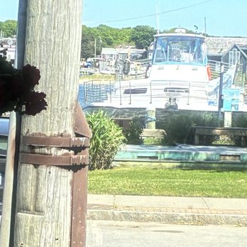 The Black Cat Tavern - View from the dining room and outdoor seating area. Across from an active harbor. - Seafood Near Me - Hyannis, Massachusetts