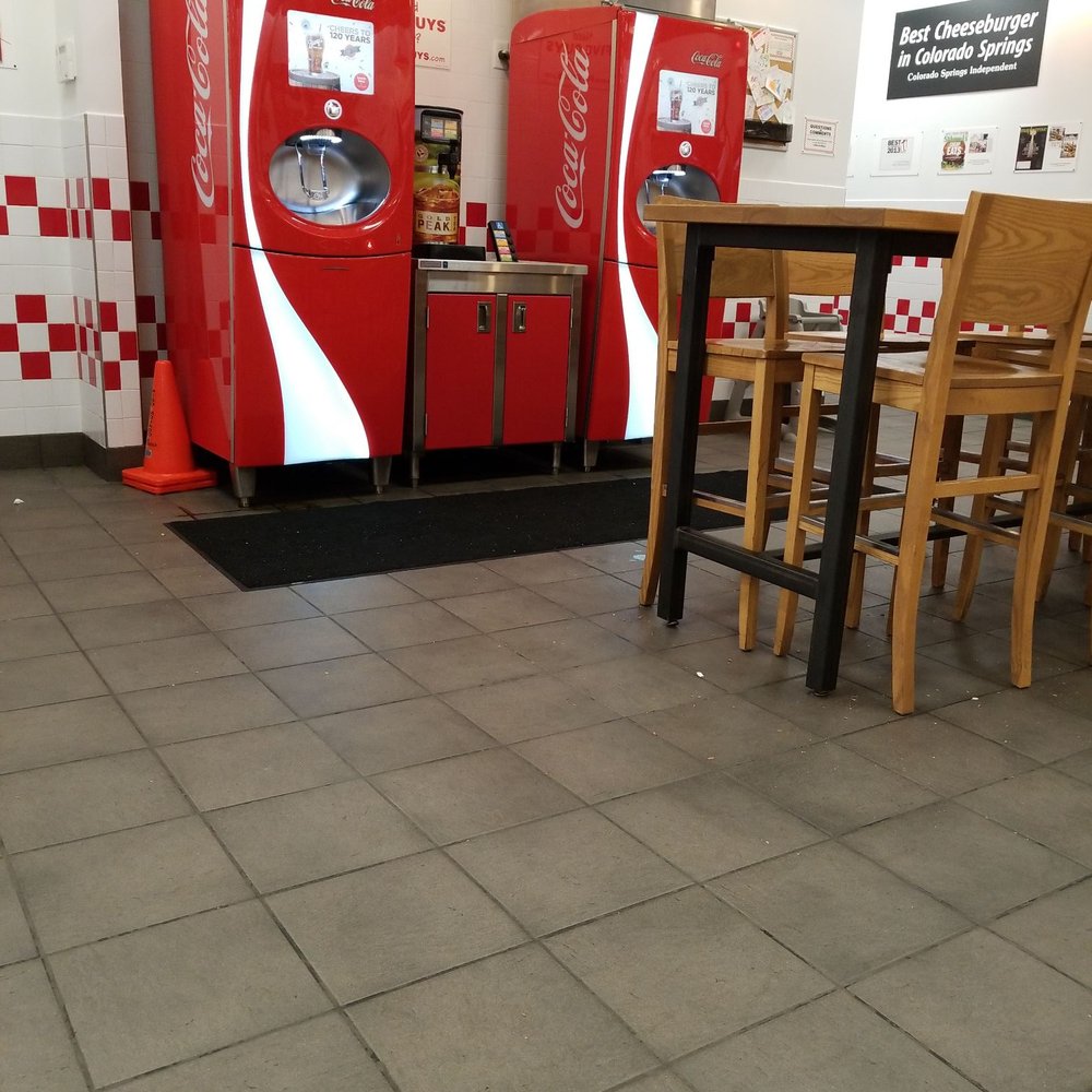 Five Guys - a row of coca cola machines in a restaurant - Burgers Near Me - Oshkosh, Wisconsin