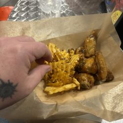 Urban Air Trampoline and Adventure Park - Spicy honey wings... Kinda small for $12, also wings are baked not fried.. Still okay 3 out of 5 taste...