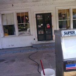 The picture of the front door with the address and open doors to the friendliest place in town